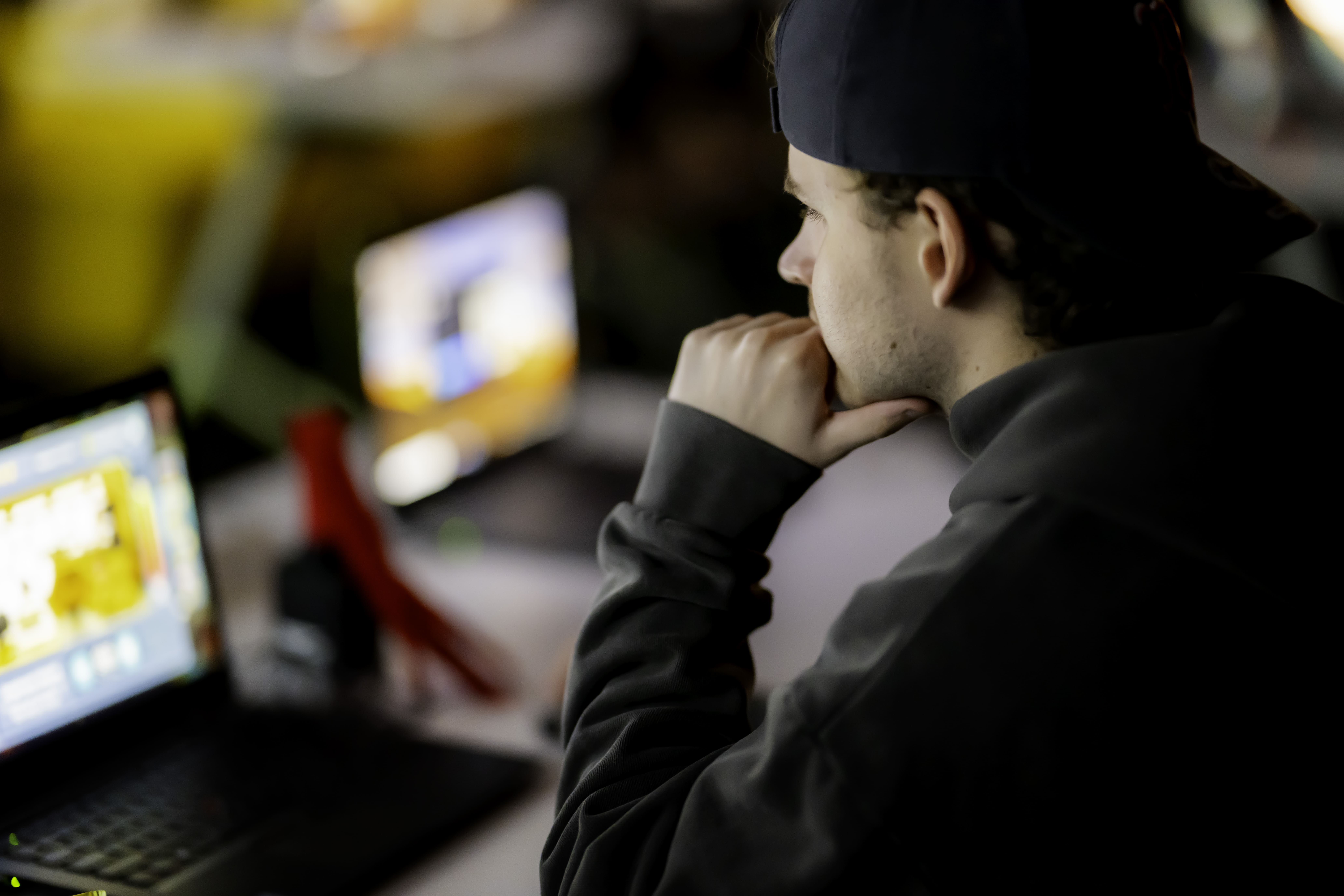 People using computers in a gaming event.
